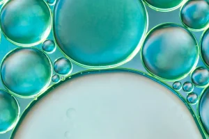 sphere-shaped-air-bubbles-water-blurred-background